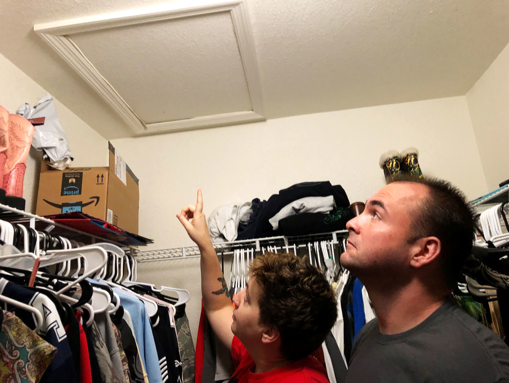 Air Force Technical Sgt. Ann Yarbrough, with husband Michael, point to the entrance of their attic, where workers found a mold infestation in their home at Keesler Air Force base in Biloxi